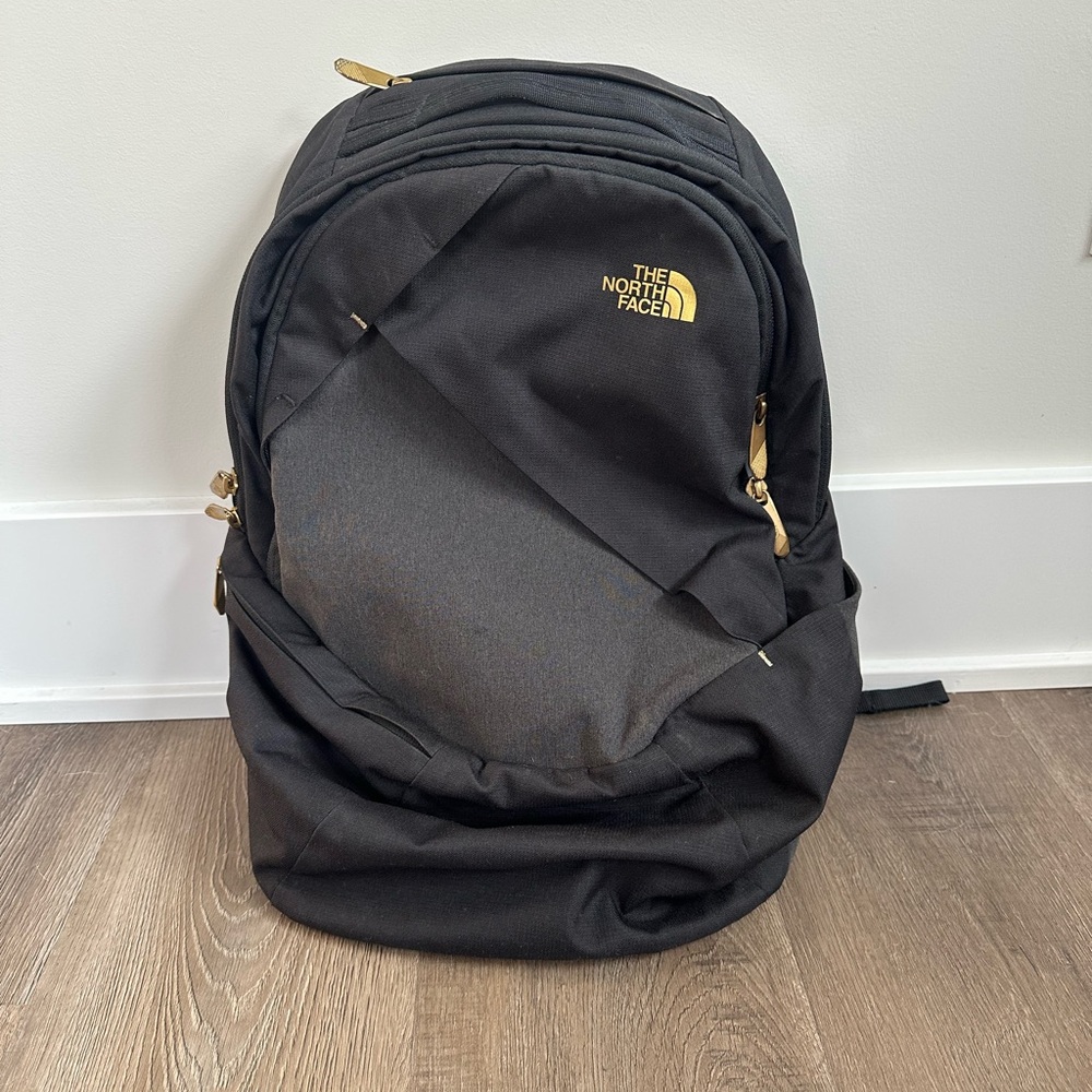The North Face Black and Gold Backpack